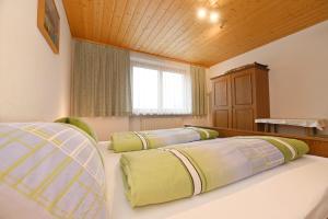 Letto o letti in una camera di Haus Valuga