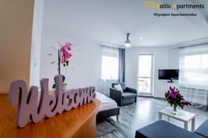 Telewizja i/lub zestaw kina domowego w obiekcie Baltic Apartments - Apartament Słoneczny Taras
