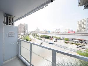 a balcony with a view of a city street at STAY IN SUMUKA Kokusai Street in Naha