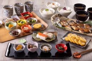 a table with many different types of food on it at Nara Royal Hotel in Nara