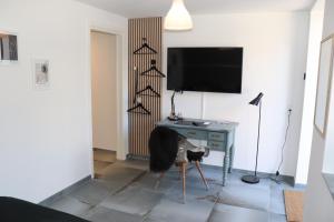 TV a/nebo společenská místnost v ubytování Hotel Petite B&B