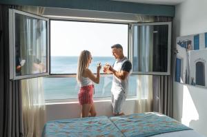 Postel nebo postele na pokoji v ubytování Hotel Villa del Mar