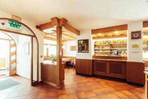 a restaurant with a counter and a bar at Ferienwohnung Pension Stern in Aldino