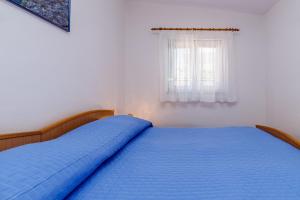 Postel nebo postele na pokoji v ubytování Holiday House Emma