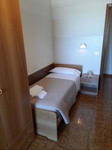 Postel nebo postele na pokoji v ubytování Albergo Italia