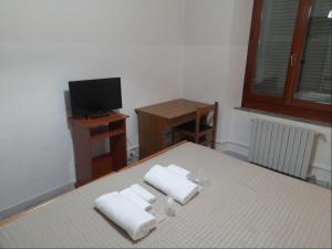 Postel nebo postele na pokoji v ubytování Albergo Italia
