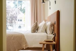 Hôtel Le Mouton Bleu客房内的一张或多张床位