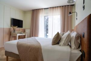 Hôtel Le Mouton Bleu客房内的一张或多张床位