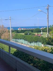 a view of a garden from a balcony at La Piscina in Marina di Massa