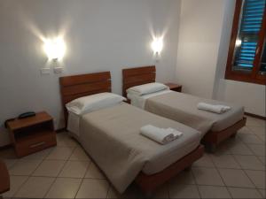 Postel nebo postele na pokoji v ubytování Albergo Italia