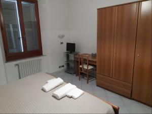 Postel nebo postele na pokoji v ubytování Albergo Italia