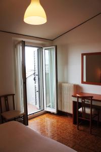 Postel nebo postele na pokoji v ubytování Albergo Italia