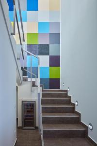 a staircase in a building with a colorful wall at Villa Roca in Vis
