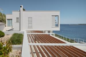 a house with a view of the ocean at Villa Roca in Vis
