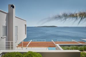 a house with a view of the water at Villa Roca in Vis