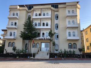 a large white building with stairs in front of it at loopy lodge hotel in Ürgüp