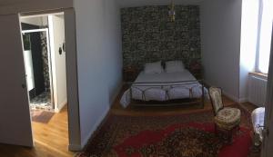 Postel nebo postele na pokoji v ubytování L'instant Présent