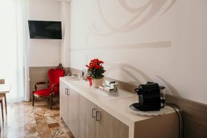 A television and/or entertainment centre at B&B Palazzo Storico Di Nicola