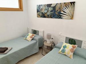 Posteľ alebo postele v izbe v ubytovaní Sunny Beach Retreat