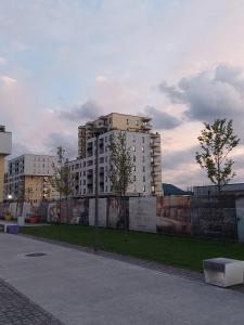 a large building with a mural on the side of it at Luxury panorama apartament,Coresi in Braşov