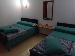 Katil atau katil-katil dalam bilik di Chalet Palmera resort ain Sukhna-egypt