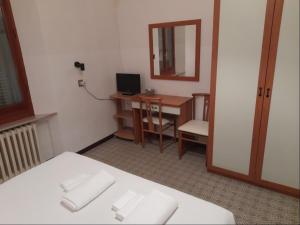 Postel nebo postele na pokoji v ubytování Albergo Italia