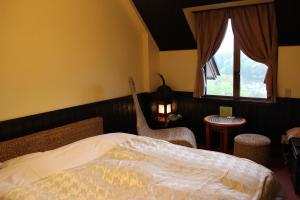 Ένα ή περισσότερα κρεβάτια σε δωμάτιο στο Matsushima Petit Hotel Bistro Abalon