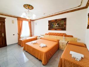 Postel nebo postele na pokoji v ubytování Euro Hotel Iglesias