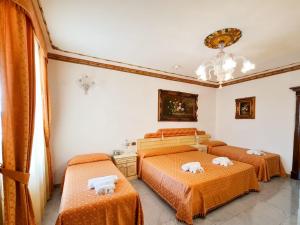 Postel nebo postele na pokoji v ubytování Euro Hotel Iglesias