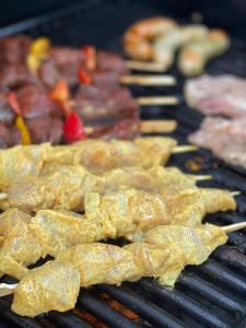 a bunch of food is cooking on a grill at Lo-Ghis Vakantieappartement Voerstreek 4P - 2slpk in Voeren