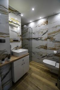 Kúpeľňa v ubytovaní Apartament Lawendowy