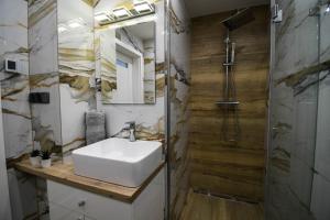 Kúpeľňa v ubytovaní Apartament Lawendowy