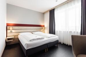 Postel nebo postele na pokoji v ubytování Hotel Smart Liv'in
