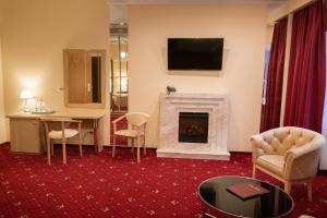 TV a/nebo společenská místnost v ubytování Hotel Ternopil