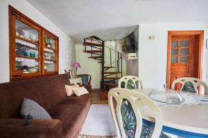a living room with a couch and a table at Cottage da Paradinha: Passadiços do Paiva - Arouca in Paradinha +33 photos