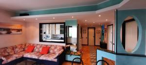 a living room with a couch and a window at La Terrazza Casa Vacanza in Carenno