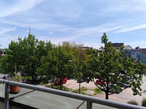 a view of a city with trees on a balcony at instantSleep Backpackerhostel St Pauli in Hamburg