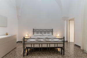 Postel nebo postele na pokoji v ubytování IL GIARDINO DEL MANDARINO HOUSE