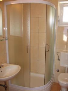 a shower in a bathroom with a sink and a toilet at Apartment in Sevid with Seaview, Balcony, Air condition, WIFI (4755-4) in Sevid