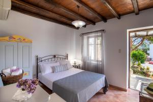 Ένα ή περισσότερα κρεβάτια σε δωμάτιο στο Cochili Rooms & Apartments