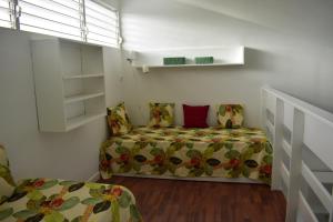 A bed or beds in a room at LA COLLINE DU LAGON