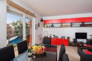 TV a/nebo společenská místnost v ubytování Apartment Azzura