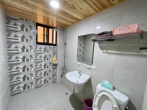 Vannituba majutusasutuses Qilixiang Homestay
