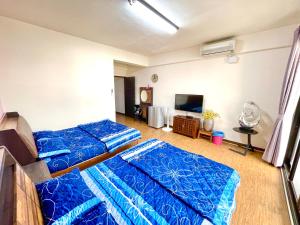 Voodi või voodid majutusasutuse Qilixiang Homestay toas