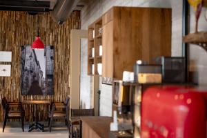 a restaurant with a table and chairs and a red light at Cavallestro Deluxe in Kitzingen