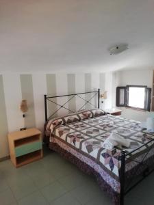 En eller flere senge i et værelse på Casa Vacanza Orizzonte