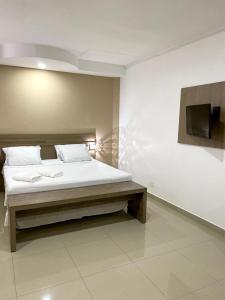 Postel nebo postele na pokoji v ubytování San Lucas Hotel