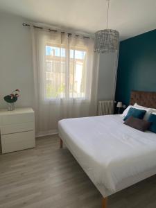 Postel nebo postele na pokoji v ubytování Vue sur Cité - SPA