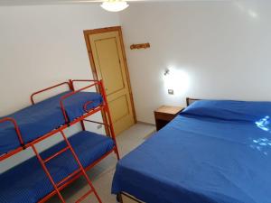 Postel nebo postele na pokoji v ubytování Golfo di Palinuro