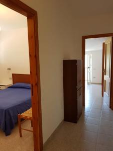 Postel nebo postele na pokoji v ubytování Golfo di Palinuro